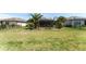 Spacious backyard with a black fence and meticulous landscaping offers privacy and outdoor enjoyment at 7855 Sw 97Th Cir, Ocala, FL 34481