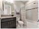 This bathroom features a shower with tub, updated vanity and a convenient toilet at 7855 Sw 97Th Cir, Ocala, FL 34481