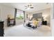 Serene main bedroom with a ceiling fan, neutral tones, and stylish decor at 7855 Sw 97Th Cir, Ocala, FL 34481