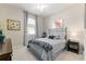 This bedroom features a queen sized bed and a relaxing neutral color palette at 7855 Sw 97Th Cir, Ocala, FL 34481