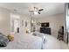 Spacious main bedroom featuring stylish decor, neutral tones, and a ceiling fan at 7855 Sw 97Th Cir, Ocala, FL 34481