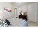 Cozy bedroom featuring neutral walls, complemented by a stylish zebra print throw and floral artwork at 7855 Sw 97Th Cir, Ocala, FL 34481