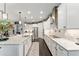 Spacious kitchen with stainless steel appliances, dark wood floors, and granite countertops at 7855 Sw 97Th Cir, Ocala, FL 34481
