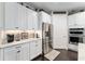 Well-equipped kitchen with granite countertops, stainless steel appliances, and ample cabinet and counter space at 7855 Sw 97Th Cir, Ocala, FL 34481