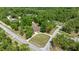 Aerial view of a home on a large lot surrounded by mature trees and located at a corner at 8221 Sw 217 Ct, Dunnellon, FL 34431