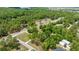 Scenic aerial view of a charming home nestled among lush green trees in a serene neighborhood at 8221 Sw 217 Ct, Dunnellon, FL 34431