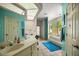 Bright bathroom boasting a vanity, tiled floor, soaking tub and a separate glassed shower at 8221 Sw 217 Ct, Dunnellon, FL 34431