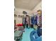 Walk-in closet with ample hanging space, wire shelving, and an organized storage layout at 8221 Sw 217 Ct, Dunnellon, FL 34431