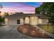 Charming single-story home with a manicured lawn, landscape lighting and a two-car garage at 8221 Sw 217 Ct, Dunnellon, FL 34431