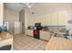 Spacious kitchen with stainless steel appliances, and ample cabinet space at 8221 Sw 217 Ct, Dunnellon, FL 34431