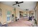 Covered patio with neutral paint, ceiling fans, brick flooring, and lots of space for outdoor furniture at 8221 Sw 217 Ct, Dunnellon, FL 34431