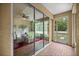 Spacious patio featuring brick flooring, neutral paint, large sliding doors that bring the outdoors in at 8221 Sw 217 Ct, Dunnellon, FL 34431