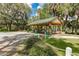 A covered picnic shelter and outdoor seating with tables and benches at 8221 Sw 217 Ct, Dunnellon, FL 34431