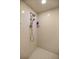 Shower with a dual head shower, square tiling, and a built-in shelf for convenience at 8221 Sw 217 Ct, Dunnellon, FL 34431