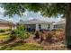 Well-maintained backyard featuring a lush garden, healthy landscaping, and an enclosed patio at 8546 Sw 79Th Ave, Ocala, FL 34476