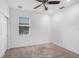 Bedroom featuring neutral carpet, a ceiling fan, and a window with blinds at 8546 Sw 79Th Ave, Ocala, FL 34476