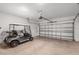 Spacious two-car garage with an open layout, golf cart and ample storage space at 8546 Sw 79Th Ave, Ocala, FL 34476