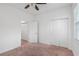 Bedroom with neutral walls, carpet, and closet featuring ample storage with sliding doors at 8546 Sw 79Th Ave, Ocala, FL 34476