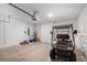 Garage space with golf cart, water heater, and lawn mower offers ample room for storage and projects at 8546 Sw 79Th Ave, Ocala, FL 34476