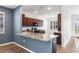 A kitchen showcases granite countertops, brown cabinets, tile flooring and stainless steel appliances at 8546 Sw 79Th Ave, Ocala, FL 34476
