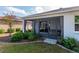 This view showcases a screened-in patio and lush garden, offering a serene outdoor space at 8546 Sw 79Th Ave, Ocala, FL 34476