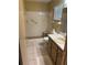Bathroom featuring tiled walls, a toilet, vanity and a walk-in shower at 8680 Sw 94Th St # D, Ocala, FL 34481