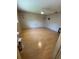 Bedroom with wood flooring, a ceiling fan, and natural lighting at 8680 Sw 94Th St # D, Ocala, FL 34481