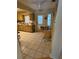 Bright kitchen with tiled floors, wooden cabinets, and natural lighting at 8680 Sw 94Th St # D, Ocala, FL 34481