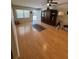 Bright living area featuring wood floors, ceiling fan, and exterior access at 8680 Sw 94Th St # D, Ocala, FL 34481
