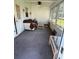 Cozy sunroom featuring an exterior view, carpeted floors, and natural lighting at 8680 Sw 94Th St # D, Ocala, FL 34481