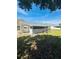 The backyard has a screened in porch that overlooks the landscaped yard at 8683 Sw 62Nd Ct, Ocala, FL 34476