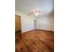 Bedroom featuring walk-in closet and wood-look flooring at 8683 Sw 62Nd Ct, Ocala, FL 34476