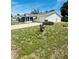 A cozy single-story home boasting a screened porch and well-manicured lawn at 8683 Sw 62Nd Ct, Ocala, FL 34476