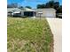 Charming single-story home with a well-maintained lawn and attached one-car garage at 8683 Sw 62Nd Ct, Ocala, FL 34476