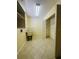 Inside laundry room with wash basin and closet with shelving at 8683 Sw 62Nd Ct, Ocala, FL 34476