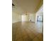 A spacious living room with tile floors, neutral walls, and lots of natural light at 8683 Sw 62Nd Ct, Ocala, FL 34476