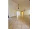 Spacious living room featuring neutral color scheme, tile flooring, and ceiling fans at 8683 Sw 62Nd Ct, Ocala, FL 34476