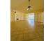 Expansive living room with a neutral color palette, tile flooring, and two ceiling fans at 8683 Sw 62Nd Ct, Ocala, FL 34476
