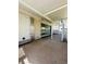 Covered patio area with lattice railing and slider entry door at 8683 Sw 62Nd Ct, Ocala, FL 34476