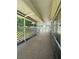 Covered patio area with lattice railing offering a relaxing outdoor space at 8683 Sw 62Nd Ct, Ocala, FL 34476
