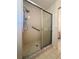 Shower with tile surround and glass door at 8683 Sw 62Nd Ct, Ocala, FL 34476