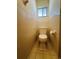 Toilet in bathroom with tiled floor and walls at 8683 Sw 62Nd Ct, Ocala, FL 34476