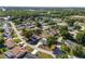 Birds eye view of home in residential neighborhood with lush green landscaping at 8851 Sw 116Th Street Rd, Ocala, FL 34481