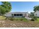 Fenced backyard with a screened-in lanai and patio area, perfect for outdoor entertaining at 8851 Sw 116Th Street Rd, Ocala, FL 34481