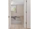 Bright bedroom with tile floors, large window, and a starfish-patterned area rug viewed from the doorway at 8851 Sw 116Th Street Rd, Ocala, FL 34481