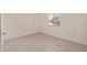 Clean bedroom featuring tile floors and a window with blinds allowing lots of natural light at 8851 Sw 116Th Street Rd, Ocala, FL 34481