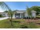 Charming house featuring a well-kept lawn and cozy porch area at 8851 Sw 116Th Street Rd, Ocala, FL 34481