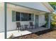 Charming front porch with seating area, perfect for relaxing and enjoying the outdoors at 8851 Sw 116Th Street Rd, Ocala, FL 34481