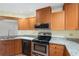 Kitchen showcasing granite countertops, stainless steel appliances, and light wood cabinets at 8851 Sw 116Th Street Rd, Ocala, FL 34481