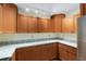 Kitchen featuring granite counters, wood cabinets, stainless steel appliances, and recessed lighting at 8851 Sw 116Th Street Rd, Ocala, FL 34481